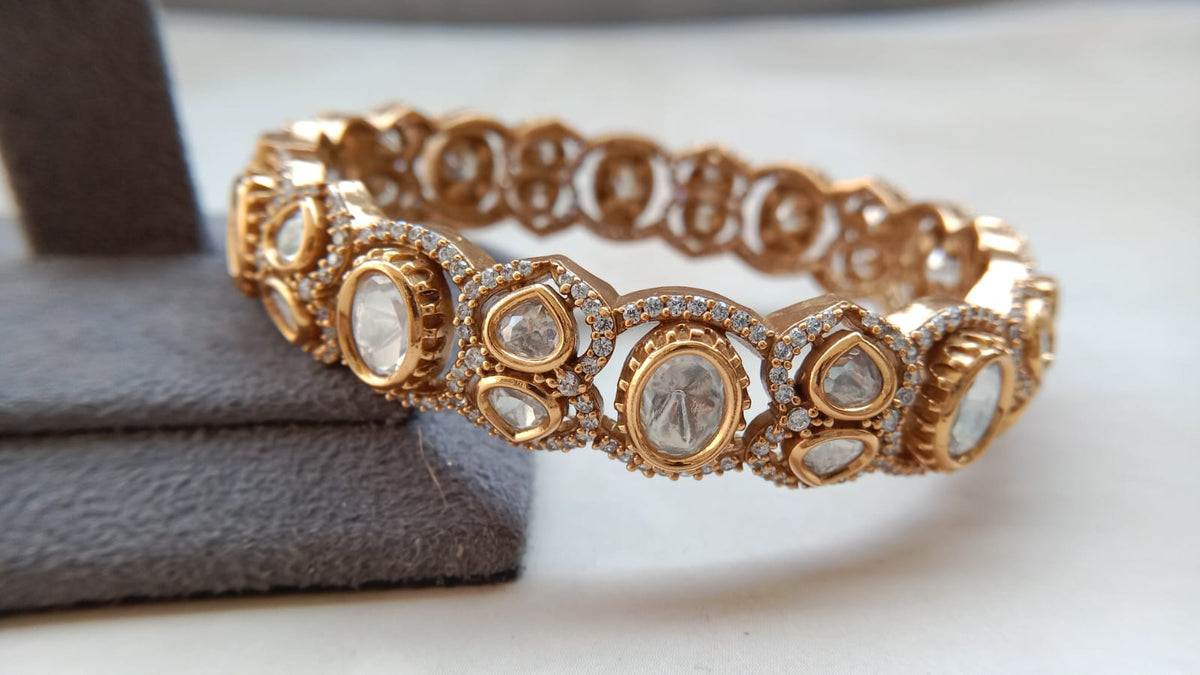 Elegant Gold Tone Openable Bracelet with Clear Stone Detailing