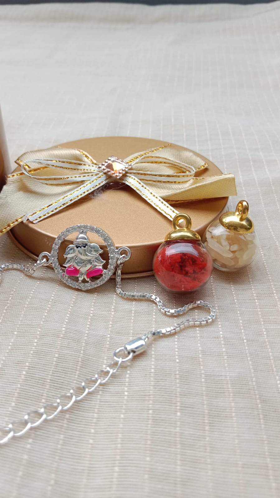 925 Pure silver Ganpati Rakhi Saffron