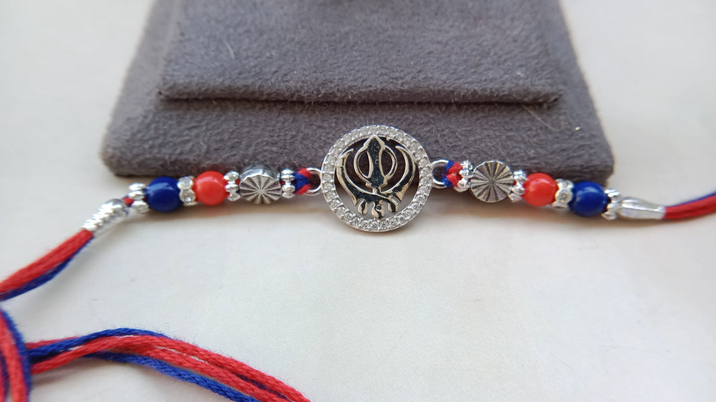 Khanda sahib Design Rakhi with Red & Blue Thread | Aryanz Jewellery