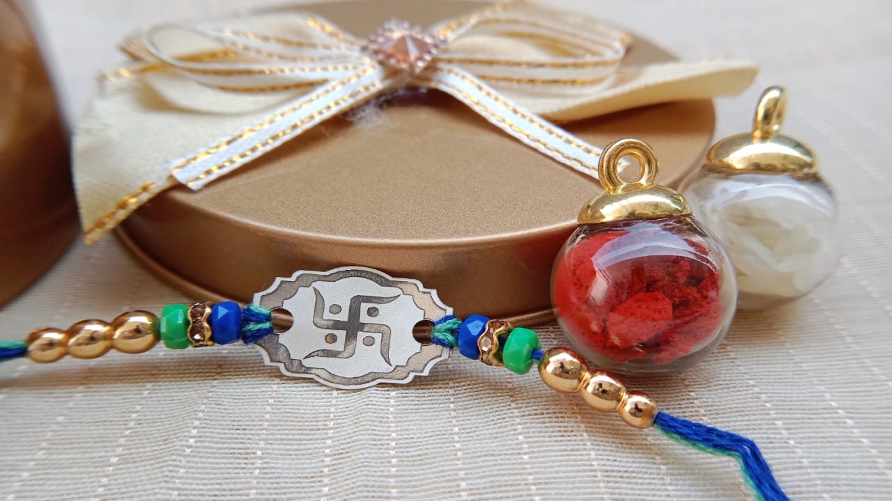 925 Pure Silver Swastik Rakhi with Blue & Green Beads