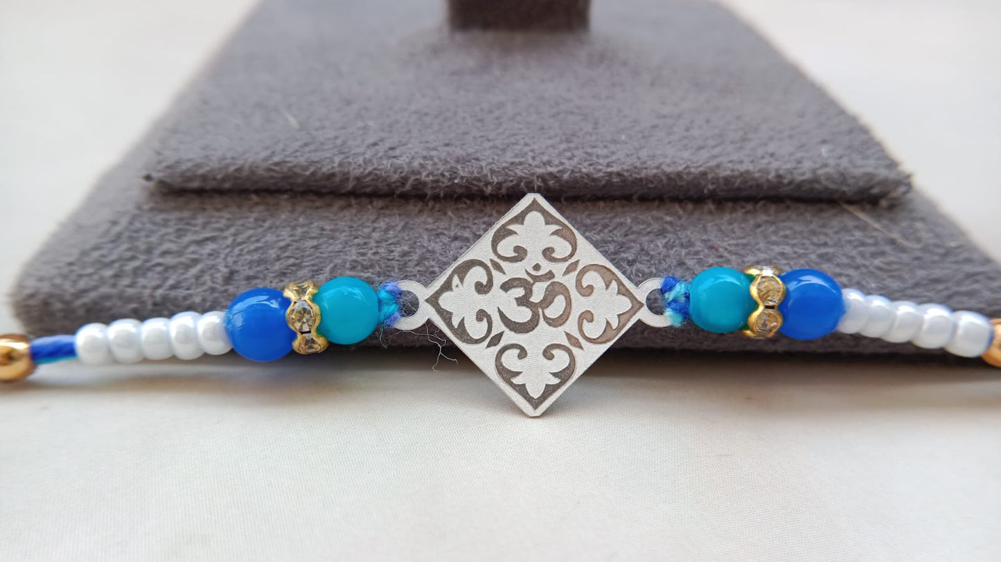 925 Pure Silver Om Rakhi with Blue & White Beads | Aryanz