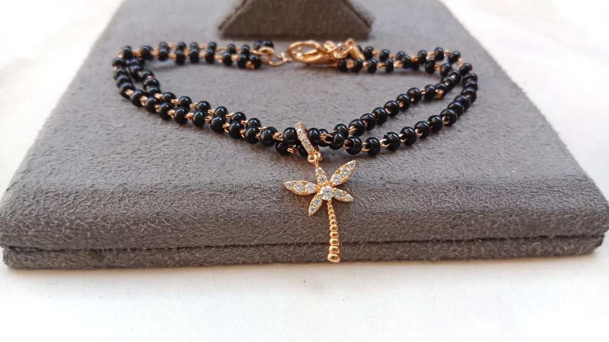 Gold Plated Black Beaded Nazar Bracelet with AD Flower Charm