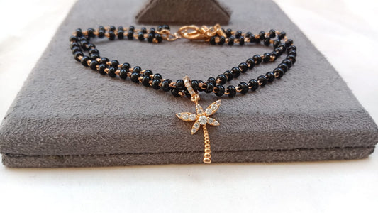 Gold Plated Black Beaded Nazar Bracelet with AD Flower Charm