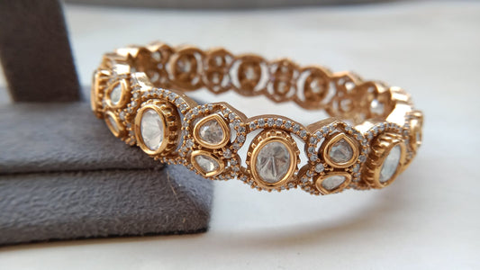 Elegant Gold Tone Openable Bracelet with Clear Stone Detailing